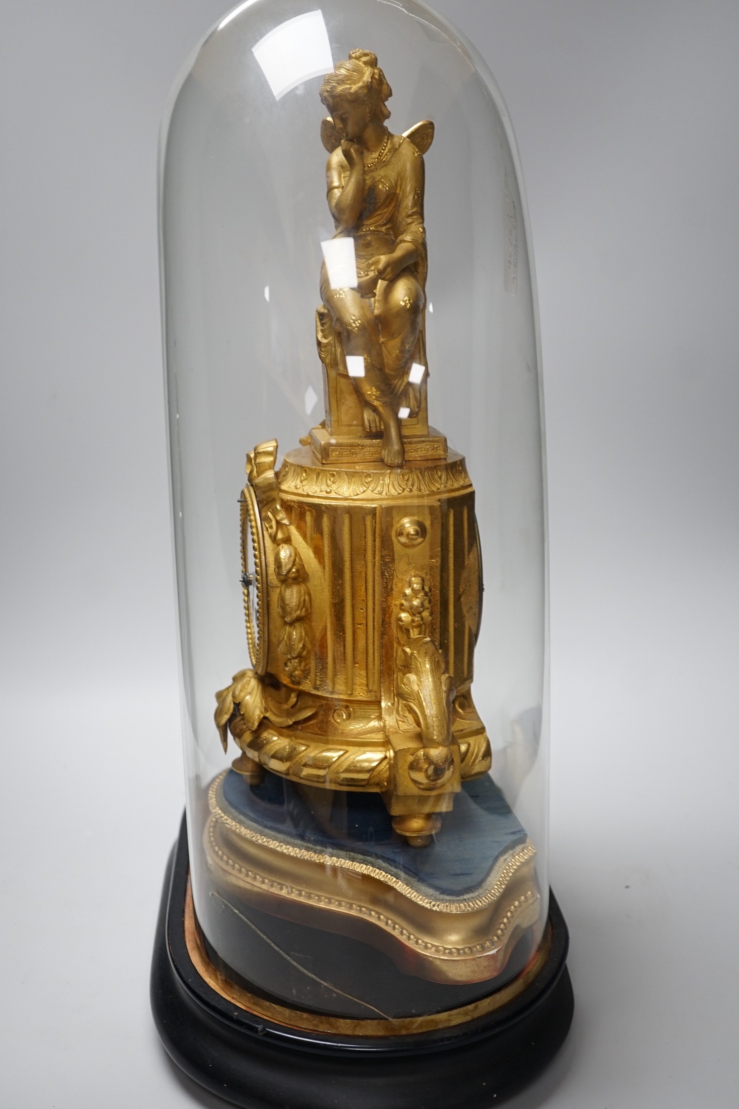 A French 19th century gilt metal clock by Phillipe H. Mourey on stand with glass dome, total height 49cm (dome a.f.)